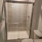 The Basic Bathroom Co. - full bathroom installation including sink, faucet, toilet, stall shower, and shower trim for a bathroom build in a finished basement in Voorhees, New Jersey – March 2022