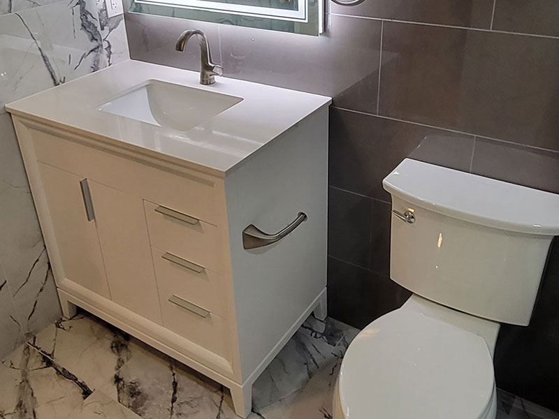 The Basic Bathroom Co. - full bathroom installation including sink, faucet, toilet, stall shower, and shower trim for a full bathroom build in a finished basement in Parsippany, New Jersey – June 2022