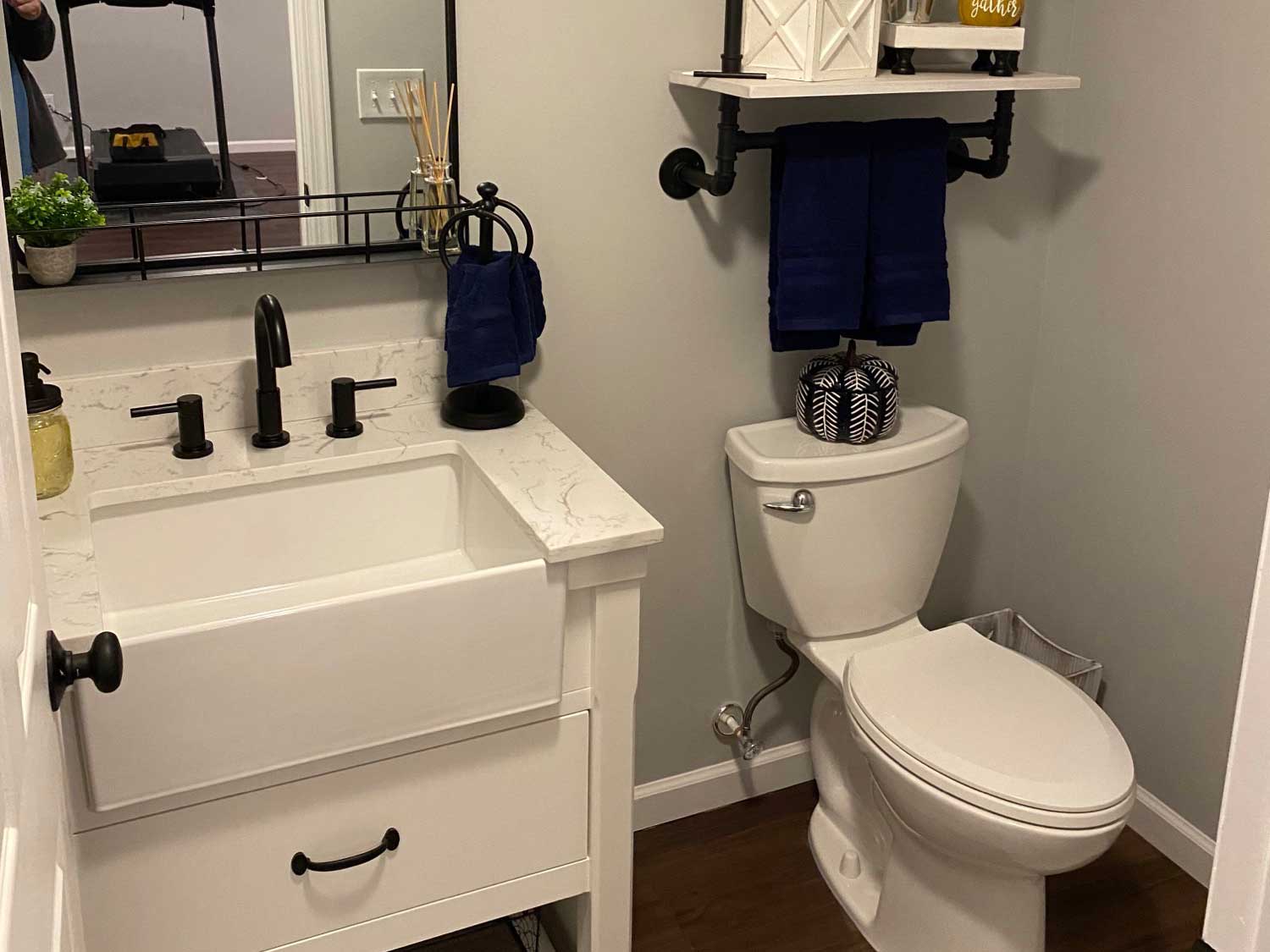 The Basic Bathroom Co. - half bathroom installation including a sink, faucet, toilet, and plumbing for a half bathroom build in a finished basement in Barnegat, New Jersey – November 2022